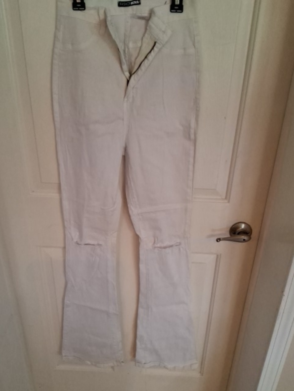 Fashion Nova White Flare Jeans with Distressed Knees